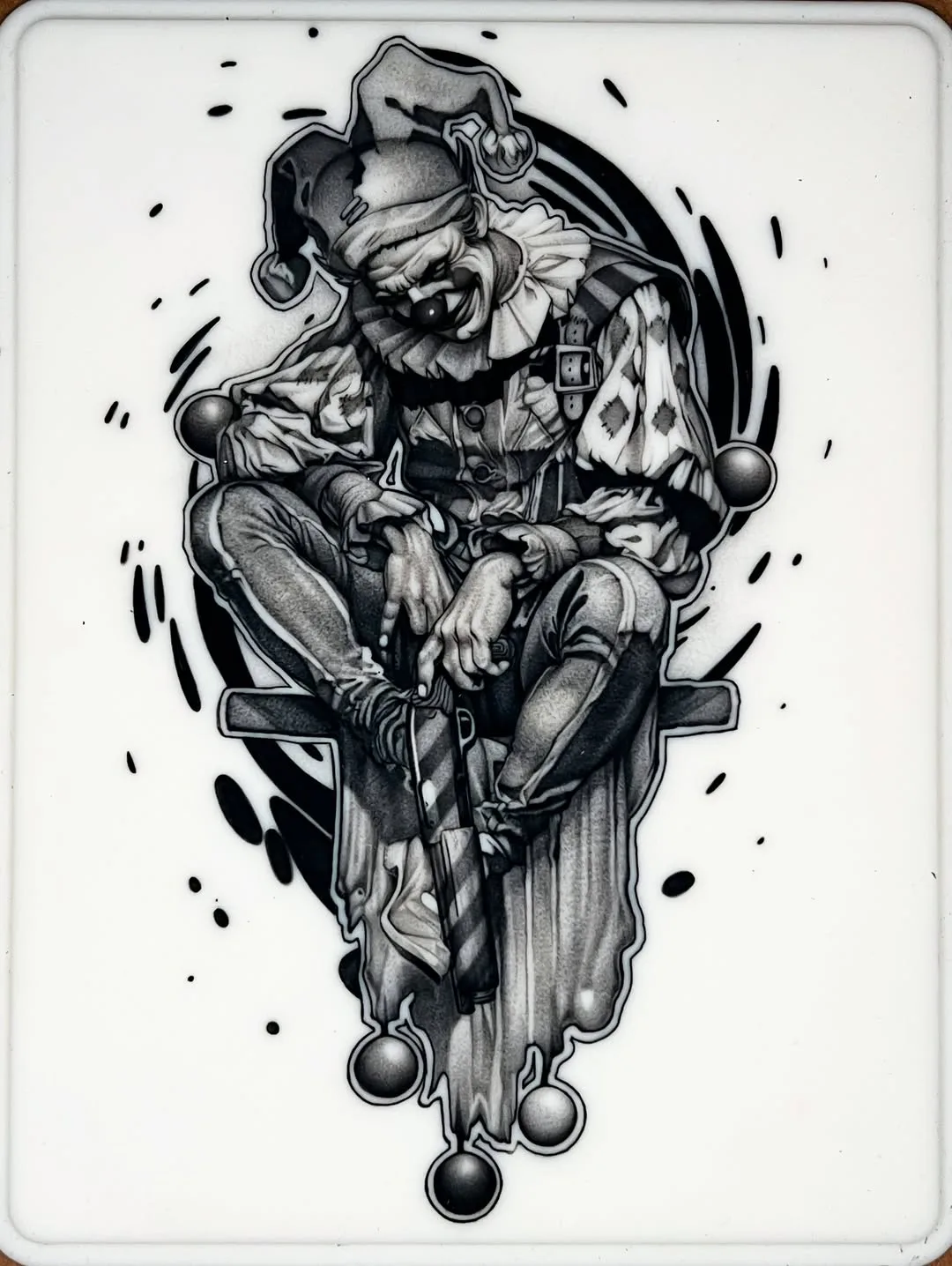 Seated clown with shotgun and top hat, black and grey piece tattooed on fake skin